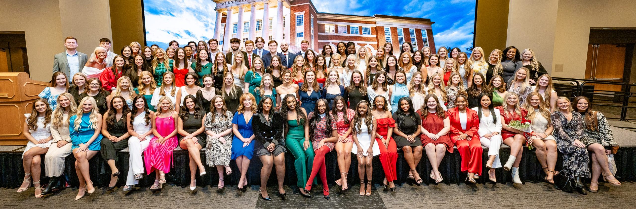 Group of students gathered for photo on stage