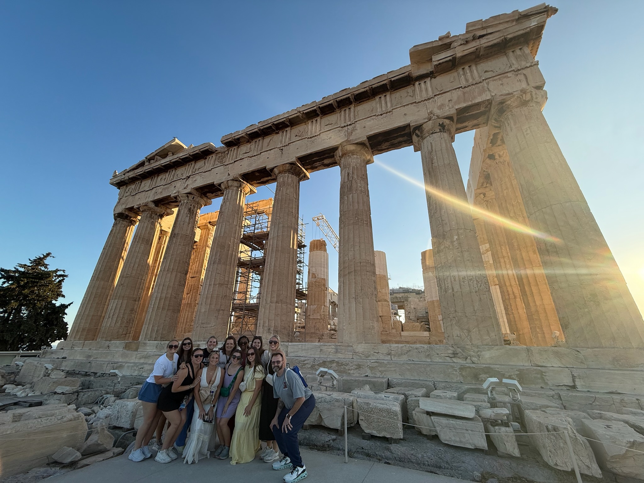 Capstone College of Nursing students in front of Greece building